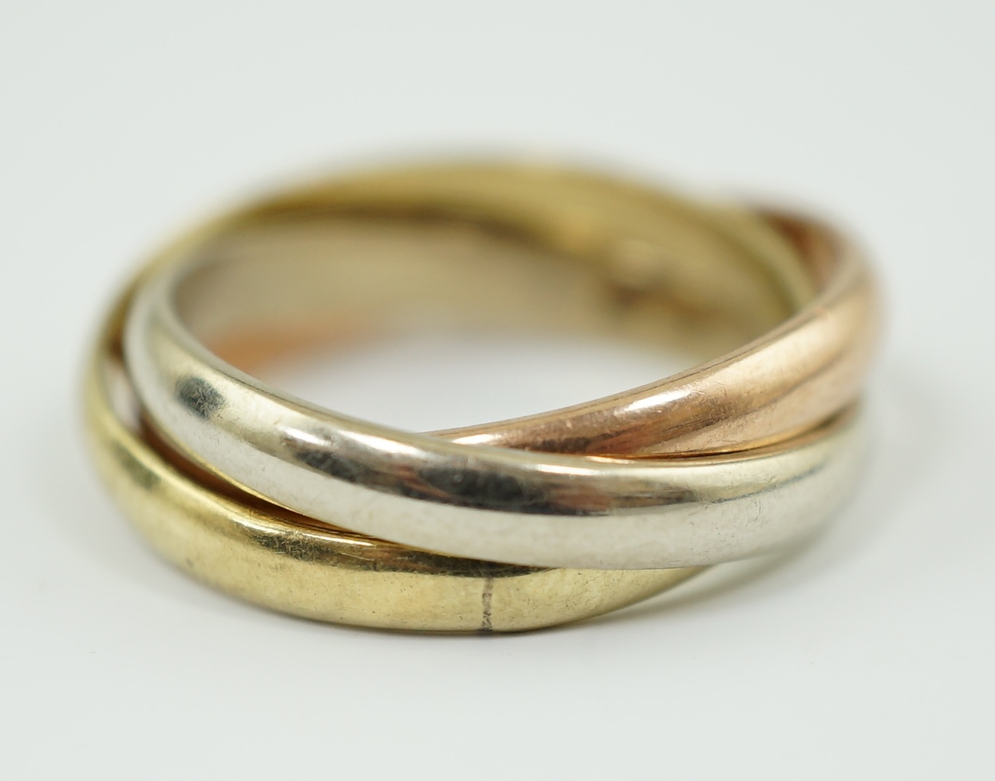 A modern three colour 14k gold 'Russian' wedding ring